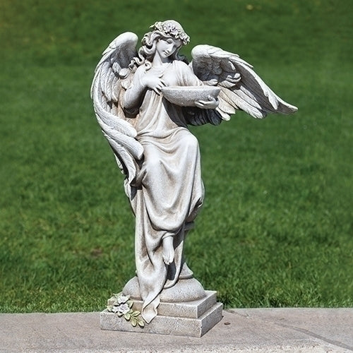 Angel garden statue with bird bath and flowers